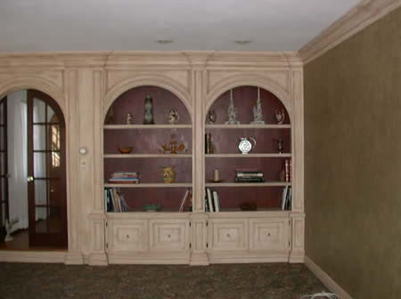 built in wall unit, wall finish,crown moulding.